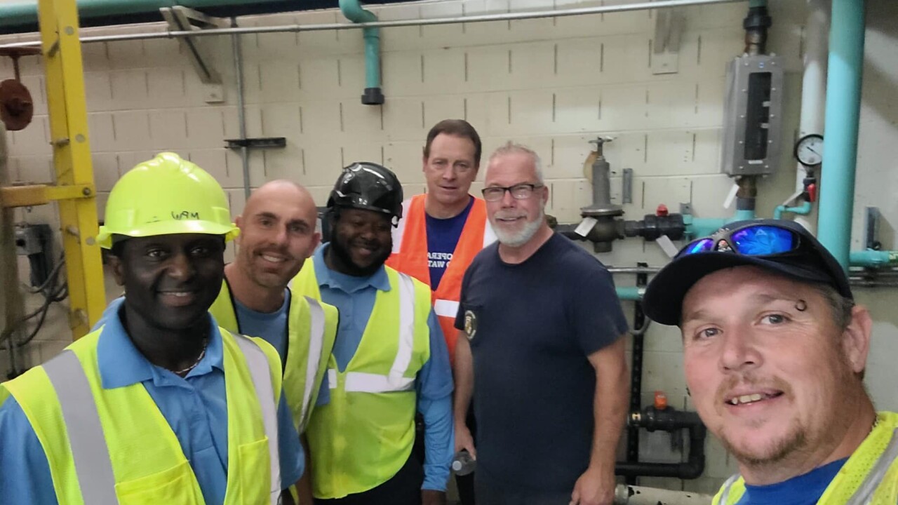 Anne Arundel County employees Rob Swann and Phil Daley are pictured with co-workers from WSSC and South Carolina