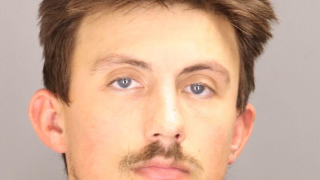Abela mugshot.png