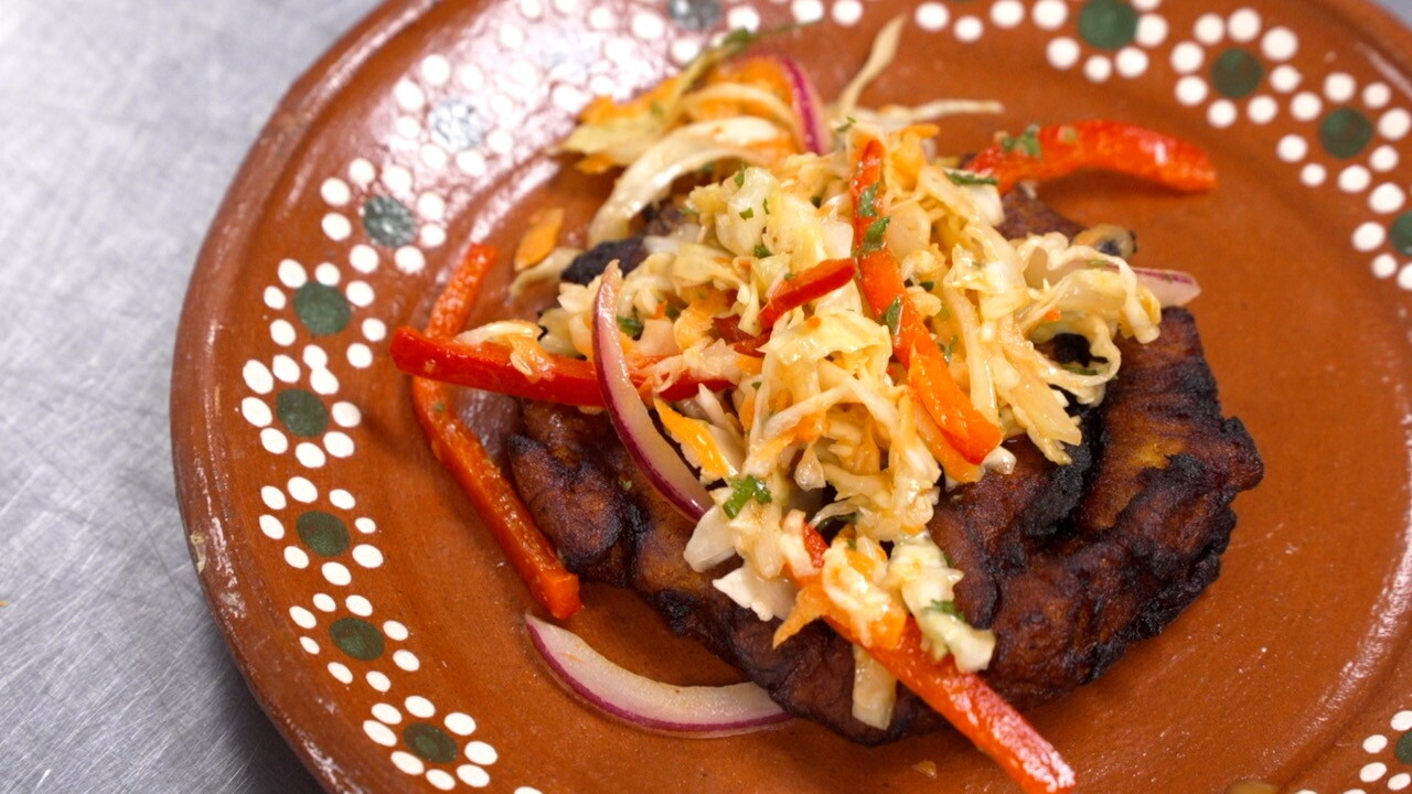 A fried plantain and pikliz