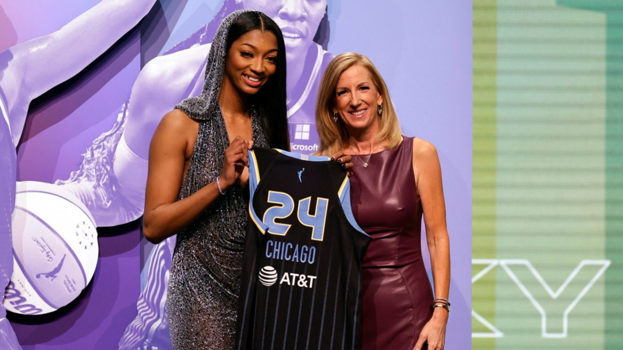 LSU's Angel Reese, left, poses for a photo with WNBA commissioner Cathy Engelbert