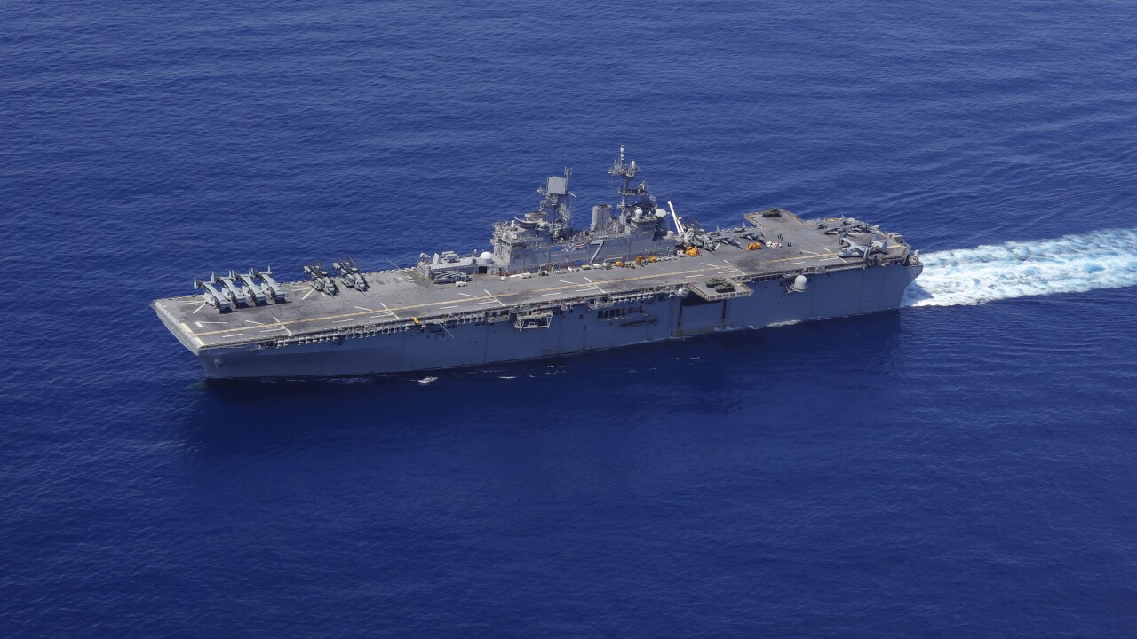 USS Iwo Jima and the USS Fort Lauderdale conduct underway operations