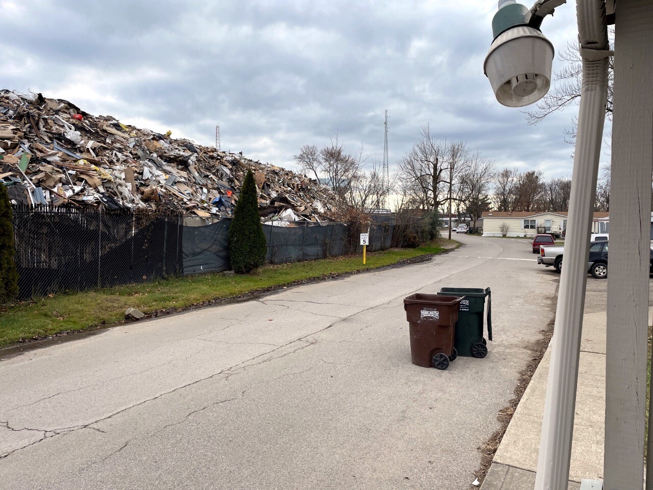 The mound of waste next to the Village Green Mobile Home Park