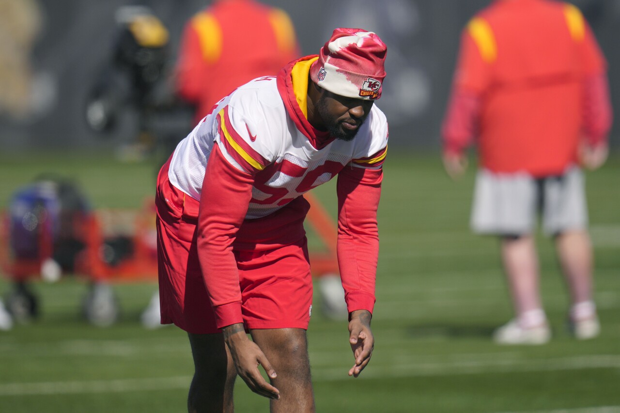 Kansas City Chiefs defensive end Joshua Kaindoh stretches during Super Bowl LVII practice, Feb. 8, 2023