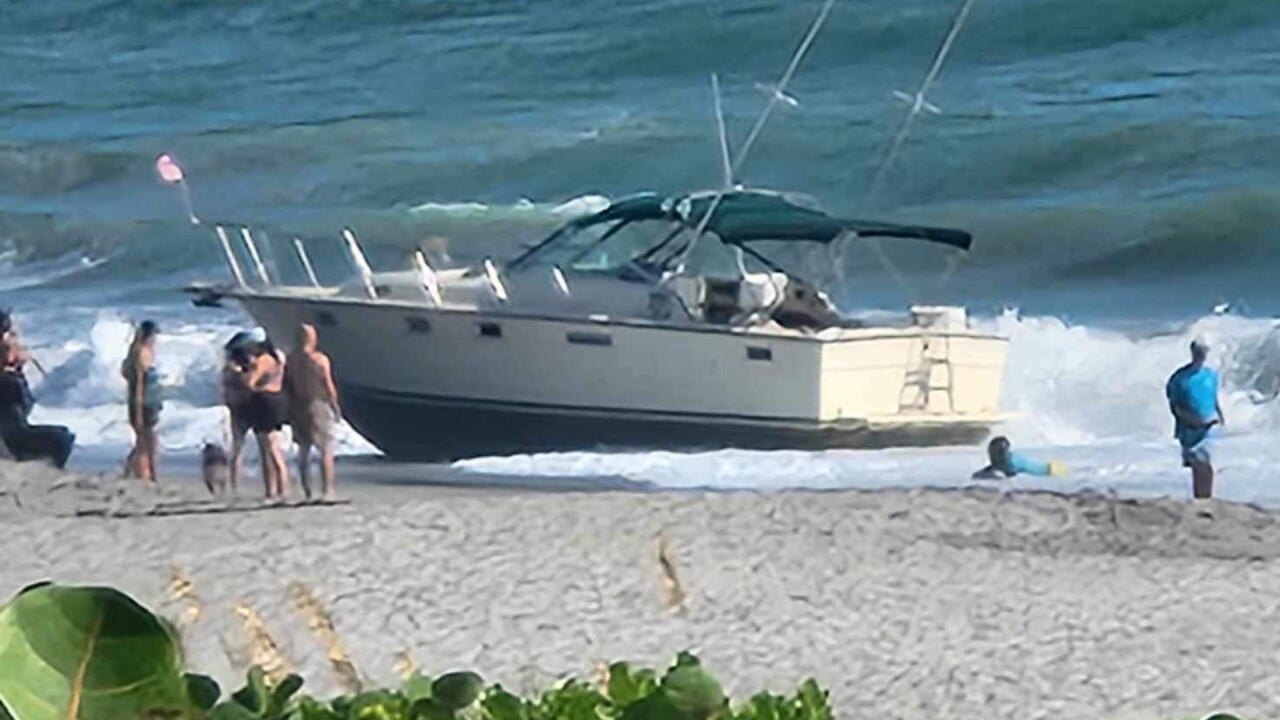 A suspected migrant boat beached just north of the Juno Beach Pier on Aug. 25, 2023.jpg