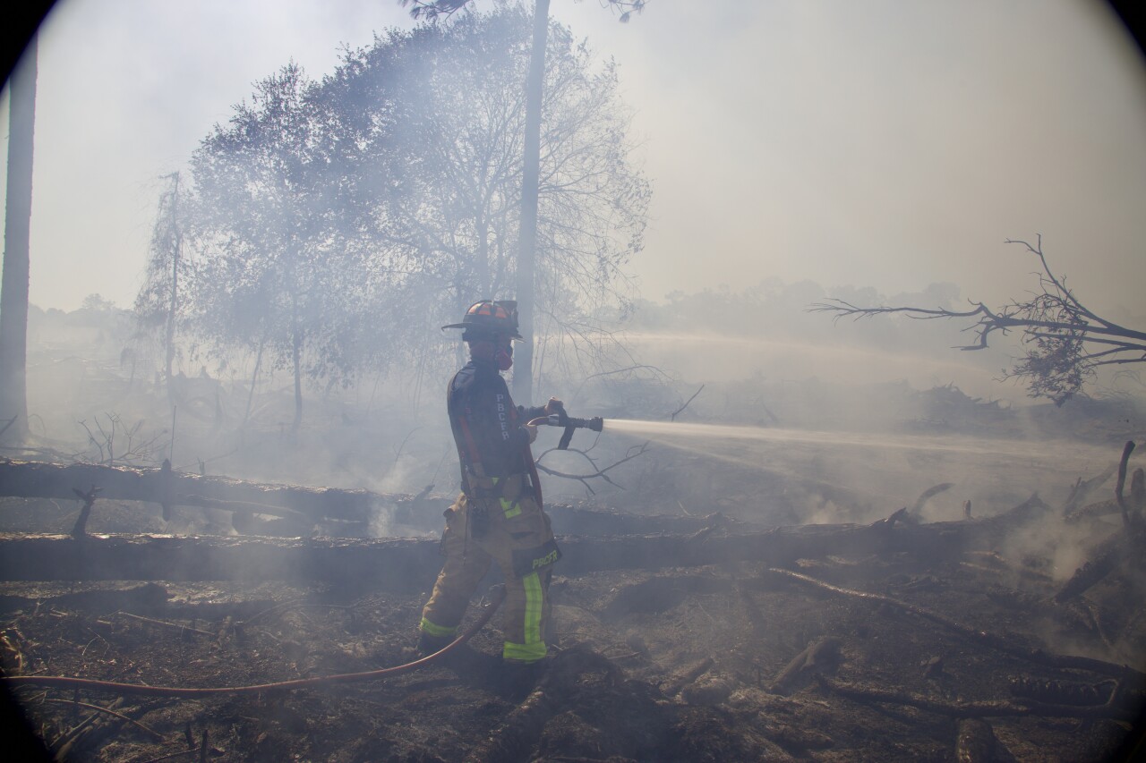Palm Beach County Fire Rescue crews work to contain brush fire in Loxahatchee area. April 15, 2024.jpeg