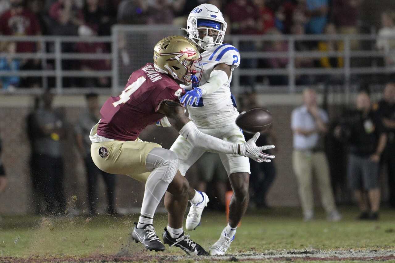 Florida State Seminoles receiver Keon Coleman catches pass while defended by Duke Blue Devils safety Jaylen Stinson, Oct. 21, 2023
