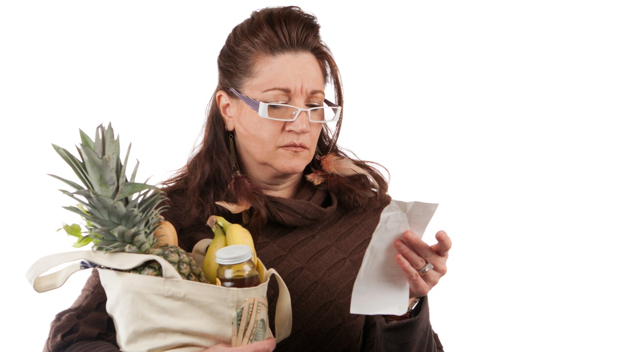 Grocery Shopper Counting Costs