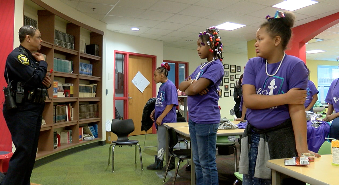 Cincinnati Police Officer Princess Davis speaking to girls from Ethel M. Taylor Academy