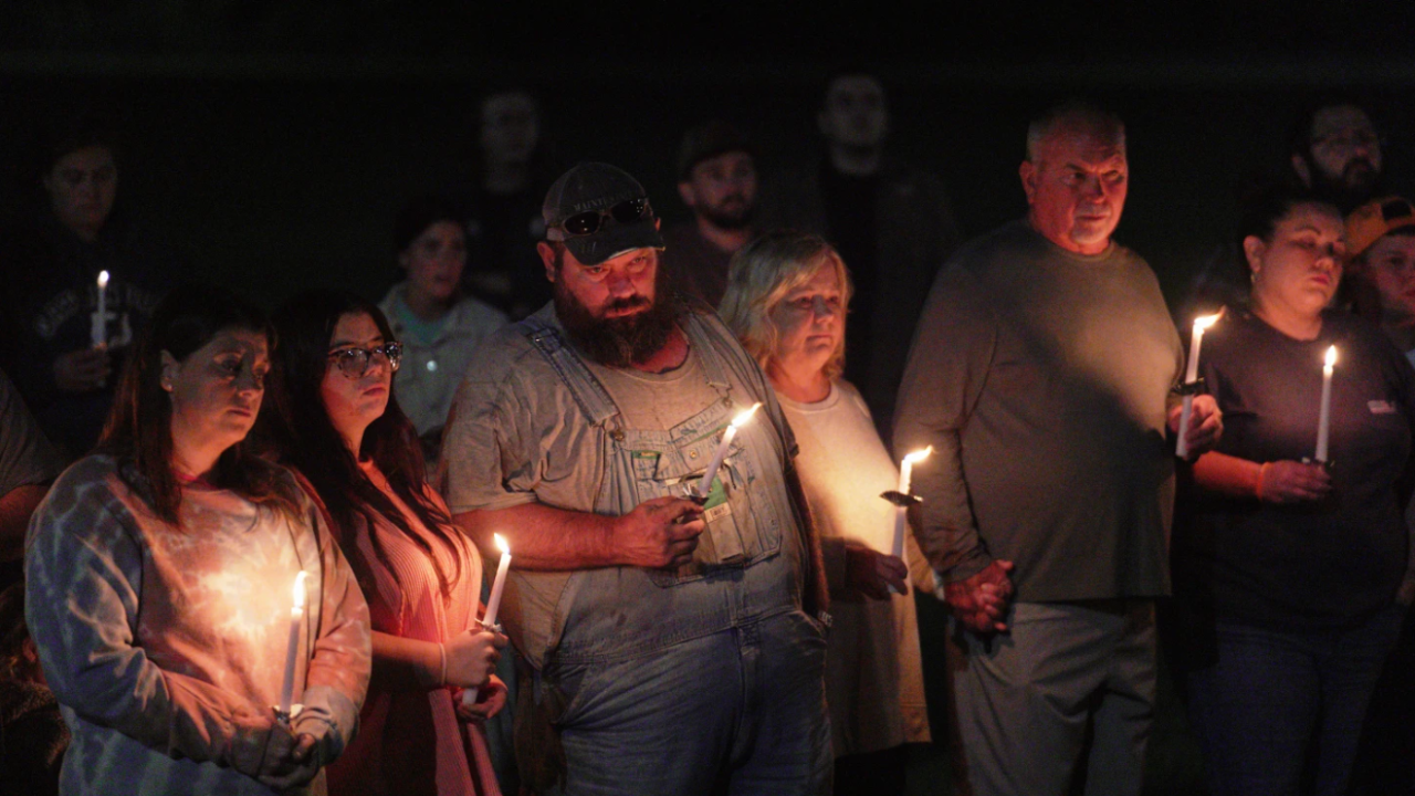 Residents attend a vigil honoring the victims of a blast at an explosives plant, Accurate Energetic Systems, on Friday, Oct. 10, 2025, in Centerville Tenn.