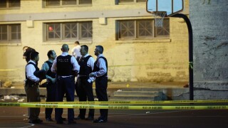 Chicago police investigate a crime scene in September 2013.