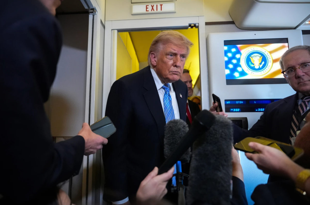 President Donald Trump speaks to reporters aboard Air Force One, Friday, May 15, 2026, as he returns from a trip to Beijing, China.