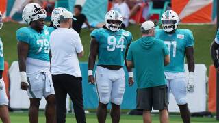 Miami Dolphins defensive end Kenneth Grant (78), defensive lineman Jordan Phillips (94), and defensive lineman Matthew Butler (91) do drills during practice at the team's NFL football training camp, Monday, Aug. 10, 2026, in Miami Gardens, Fla. 
