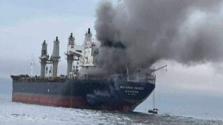 This image released by the Royal Thai Navy shows Thai cargo ship, Mayuree Naree, that was struck and set ablaze in the Strait of Hormuz Wednesday, March 11, 2026. 