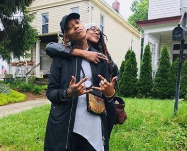 In this undated photo, Siri Imani is wearing a black ball cap and looks directly into the camera. Her mom, Jennie Wright, stands behind Imani. Wright's right arm is hugging Imani from behind as Wright looks off into the distance.