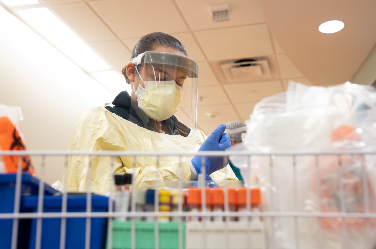 A medical worker prepares to enter the room of COVID-19 patient.