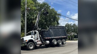 A large truck with a grabber tipped into some power lines in Jupiter on June 18, 2024. 