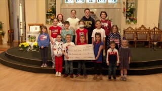 Saints Peter and Paul School raise $300 to save The USS The Sullivans.jpg