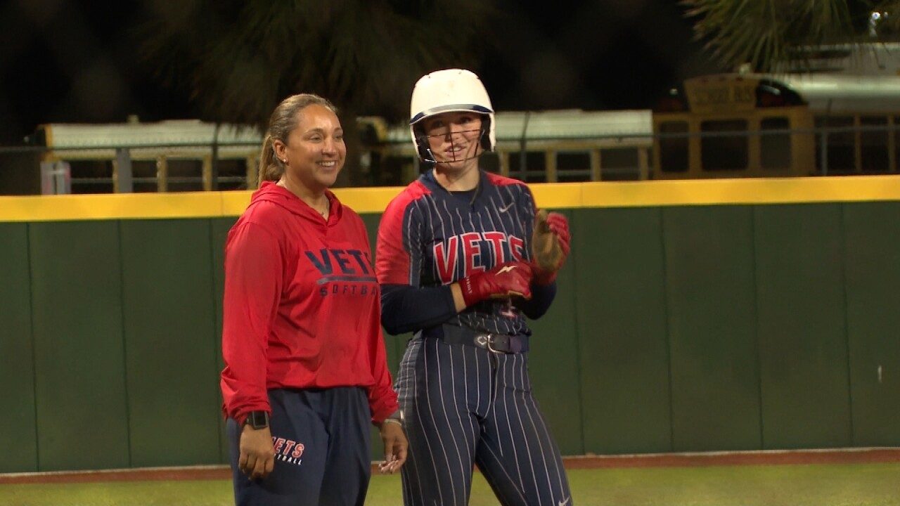 Veterans Memorial head coach Paula Salinas and Parker Malone