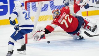 Florida Panthers goaltender Sergei Bobrovsky (72) blocks a shot by Tampa Bay Lightning defenseman Matt Dumba (24) during the second period of Game 2 of the first-round of an NHL Stanley Cup Playoff series, Tuesday, April 23, 2024, in Sunrise, Fla. 