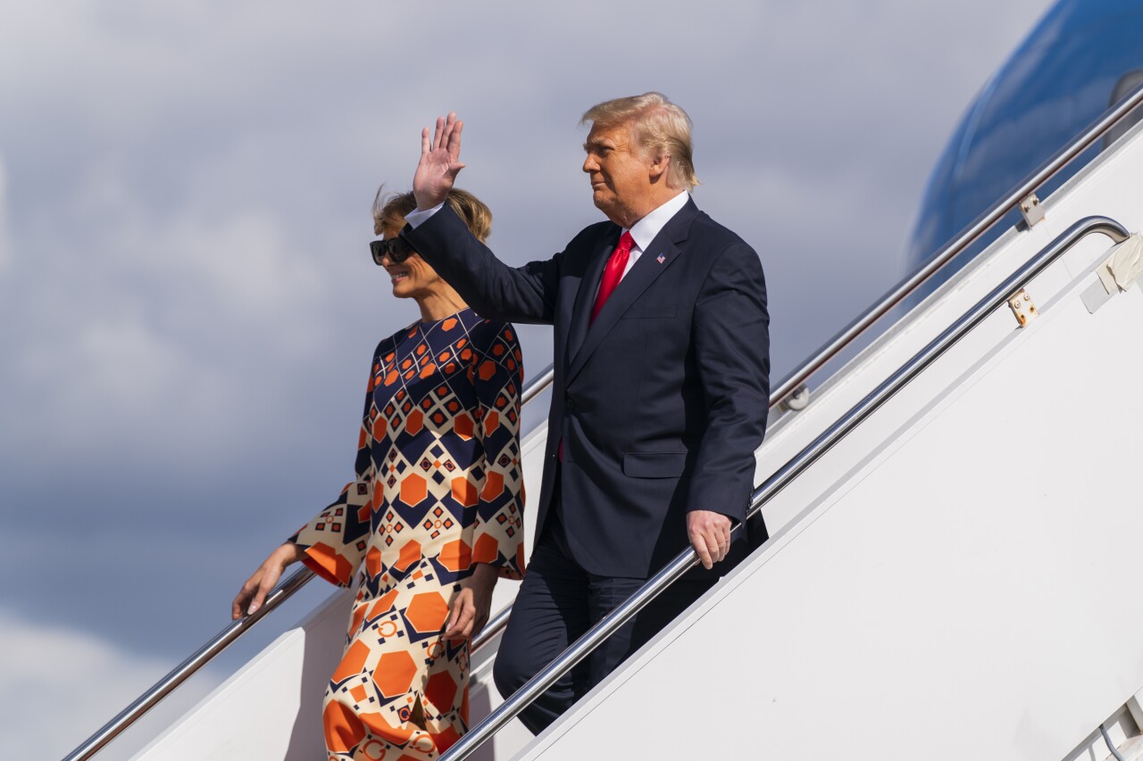 President Donald Trump and first lady Melania Trump disembark from final flight on Air Force One at Palm Beach International Airport, Jan. 20, 2021