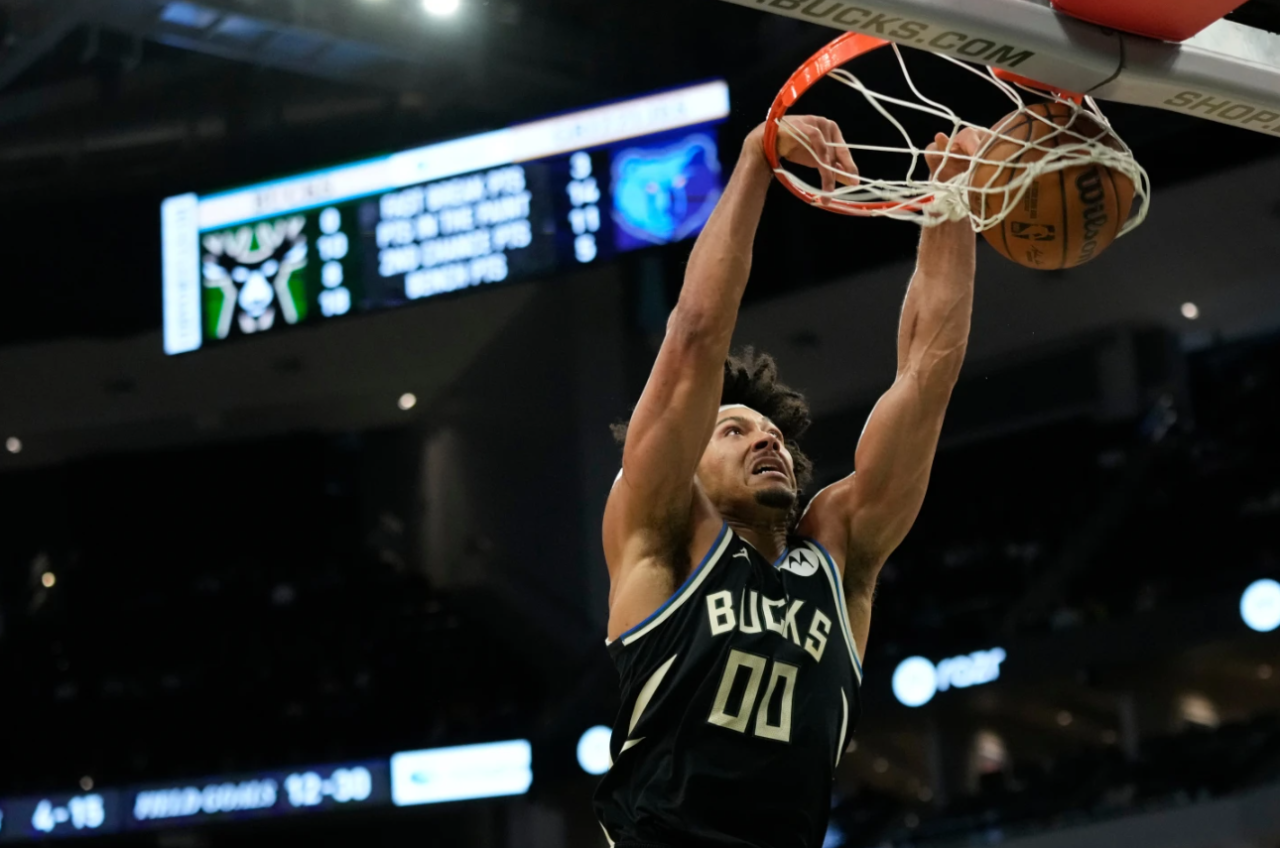 Milwaukee Bucks' Jericho Sims dunks during the first half of an NBA basketball game against the Memphis Grizzlies, Sunday, April 5, 2026, in Milwaukee.
