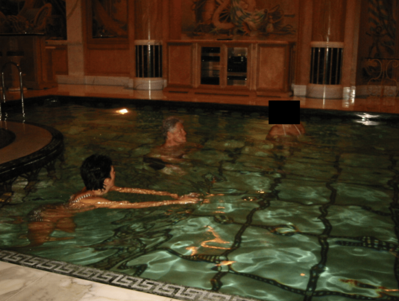 Former President Bill Clinton in a pool.