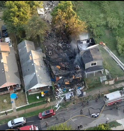 KCMO firefighters battle fire in 2 houses Thursday evening