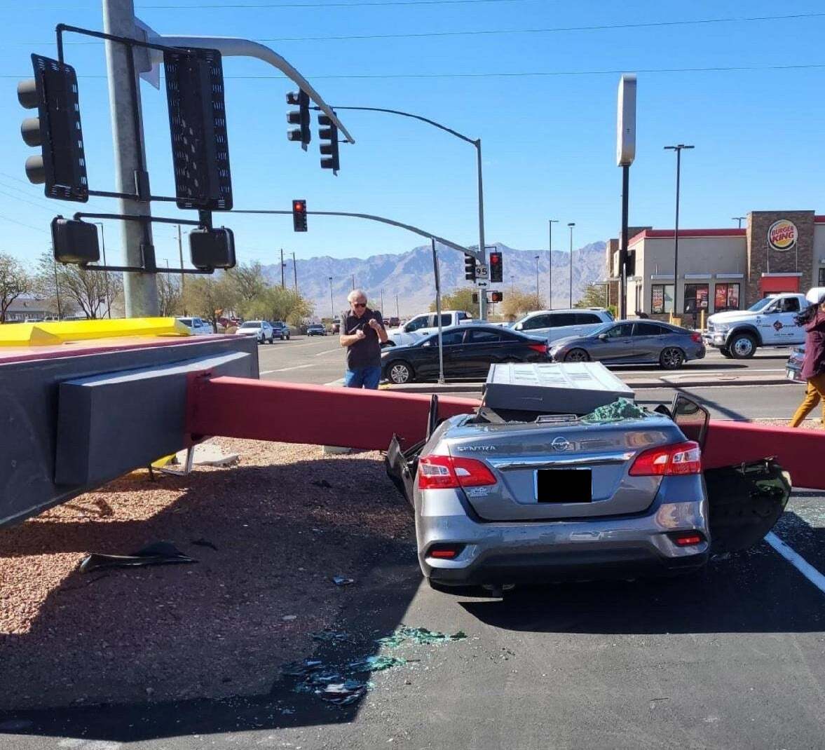 car crushed by sign