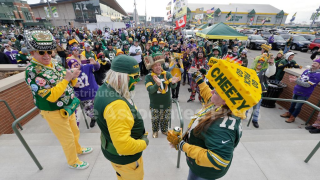 Fans tailgate before an NFL football game between the Minnesota Vikings and Green Bay Packers Sunday, Nov. 23, 2025, in Green Bay.