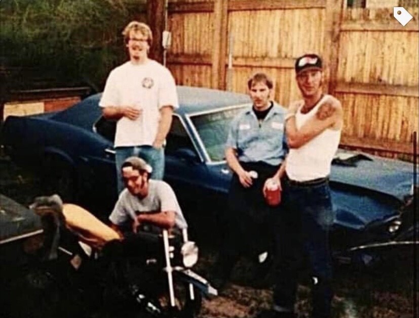 Band members and neighbor hanging out in backyard