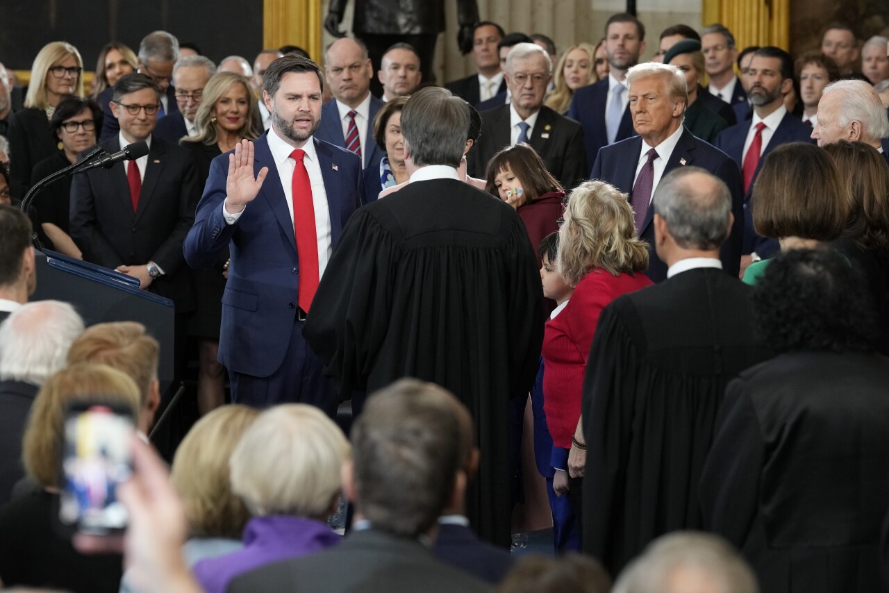JD Vance is sworn in as vice president by Supreme Court Justice Brett Kavanaugh as Usha Vance holds the Bible during the 60th Presidential Inauguration in the Rotunda of the U.S. Capitol in Washington, Monday, Jan. 20, 2025.