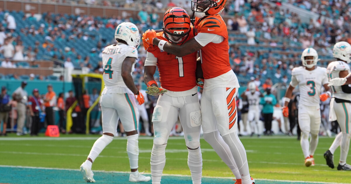 Burrow throws 4 TDs, Battle has pair of interceptions as Bengals beat Dolphins 31-24