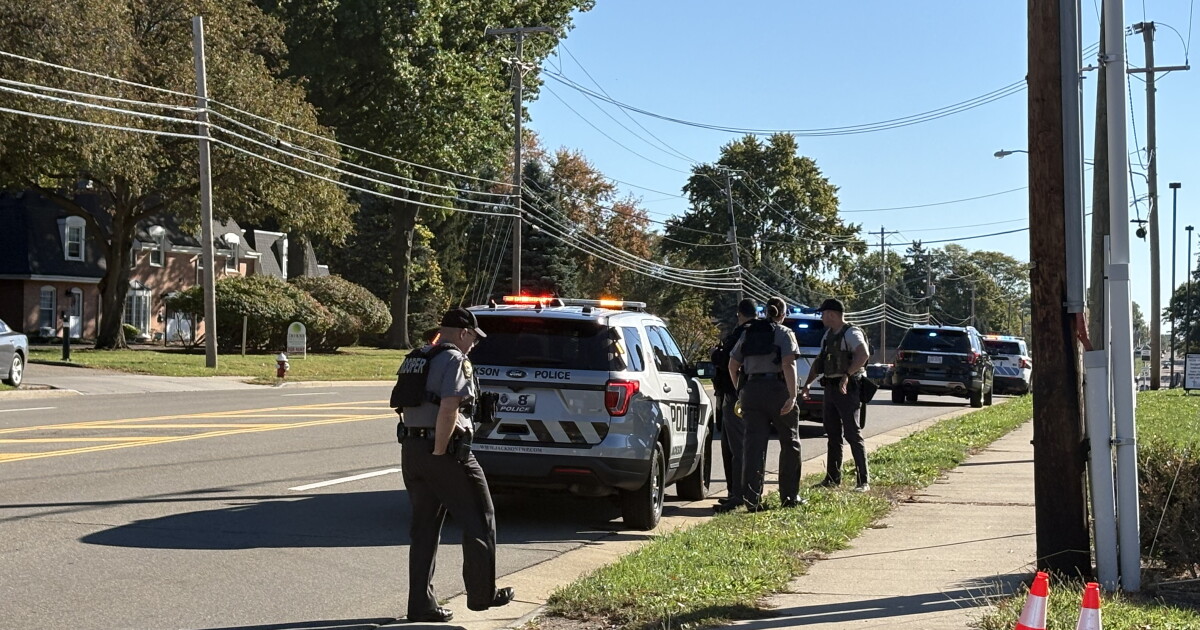 Woman shot in North Canton apartment; police fired on; suspect in custody
