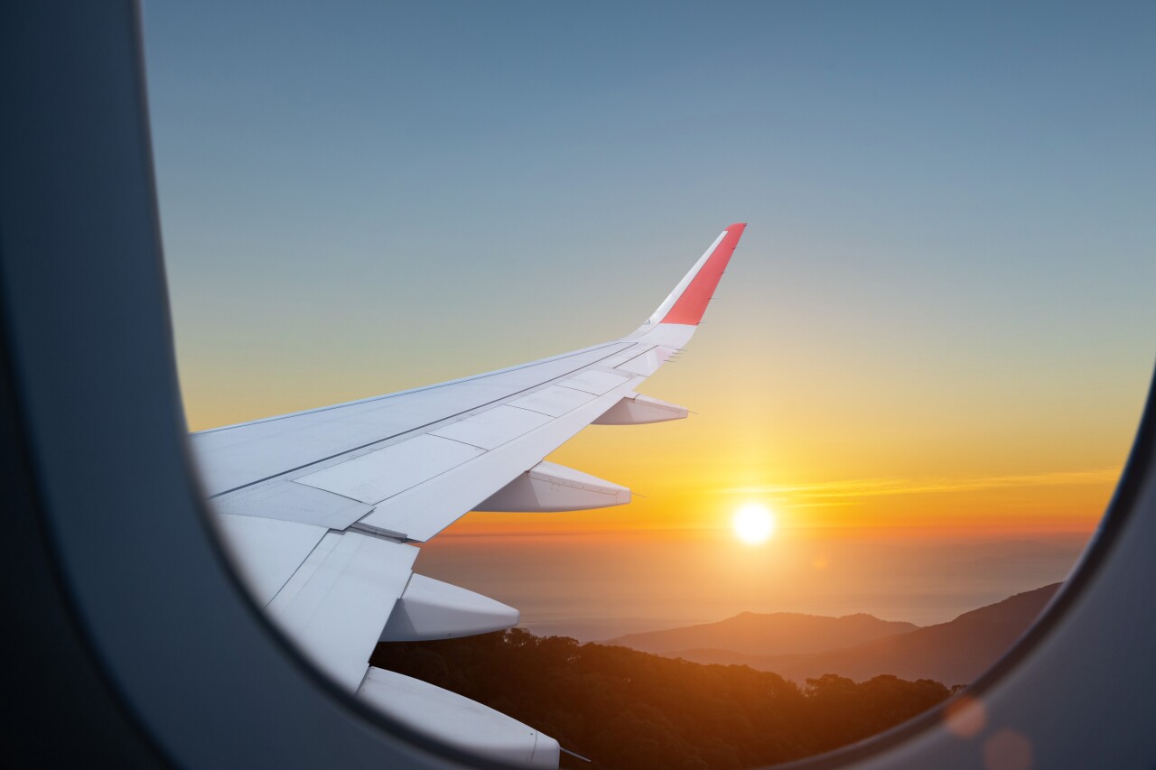 Airplane,Flying,Low,Over,Foggy,Mountains,,View,From,Plane,Window