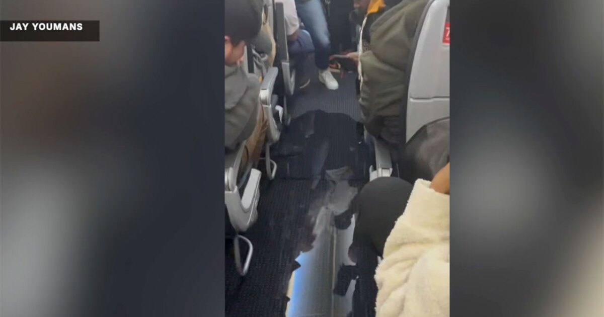 Family back home after pipe bursts on plane