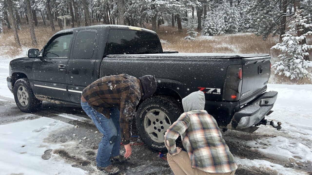Colorado drivers struggle with chaining up along I-70 during winter storms, despite a new law meant to help.jpeg