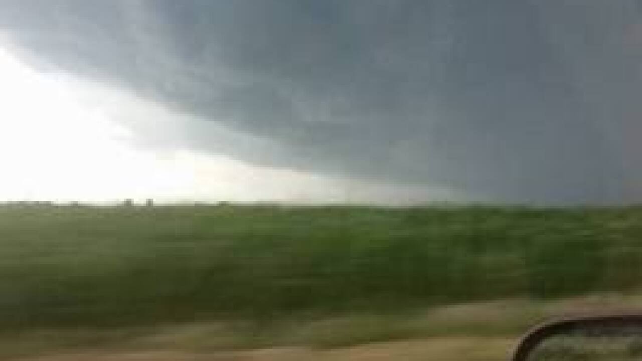 PHOTOS: Ominous skies and storm damage