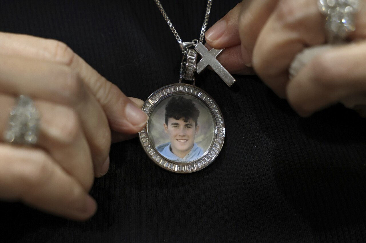 Gena Hoyer wears pendant with picture of murdered son Luke Hoyer, Oct. 20, 2021