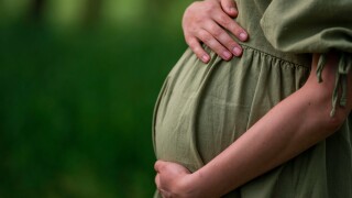 Caucasian,Young,Pregnant,Woman,Tummy,Belly,Summer,Green,Dress,Touching