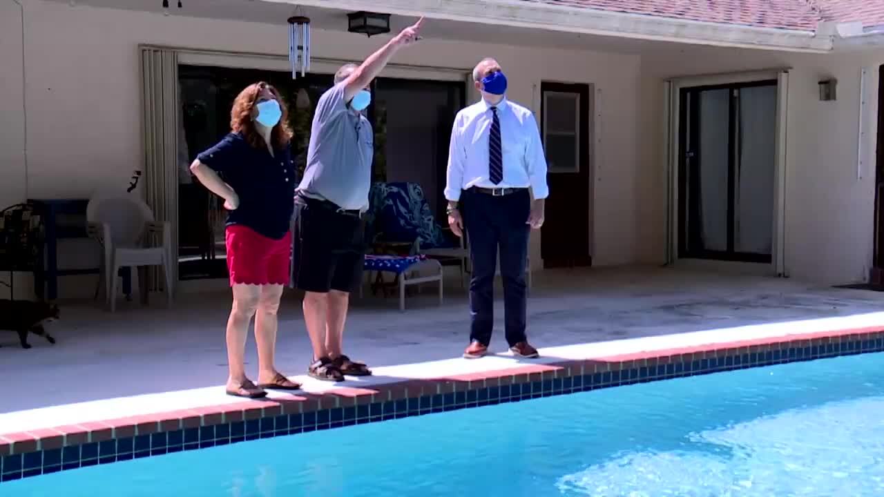 Ron and Mary Frontiero show Michael Buczyner damages to their Boca Raton home