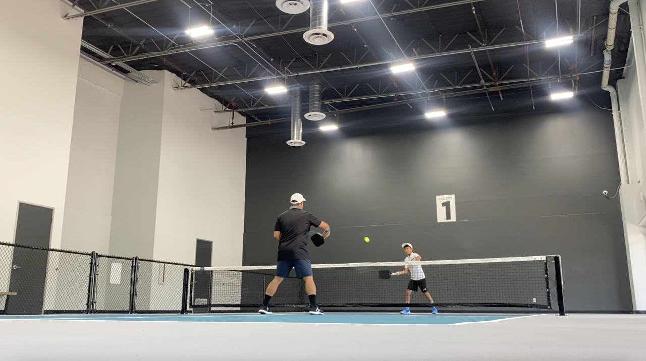 Shun and his son playing on court #1.