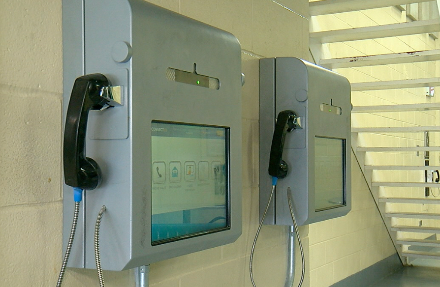 Inmates can hold video meetings with friends and family using kiosks in the prison. 