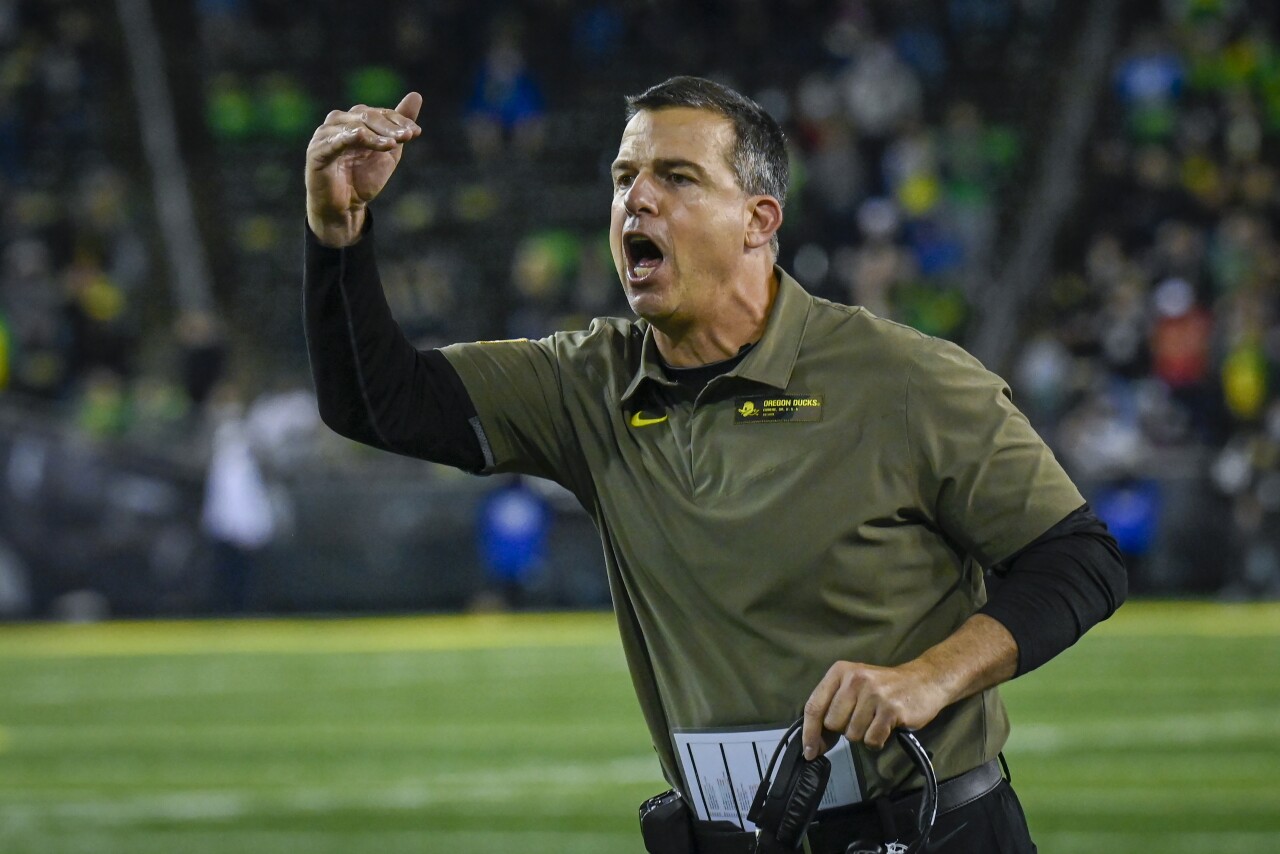 Oregon Ducks head coach Mario Cristobal on sideline arguing call during game in 2021