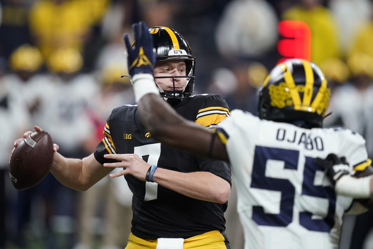 Iowa Hawkeyes QB Spencer Petras throws vs. Michigan Wolverines in 2021 Big Ten Championship game
