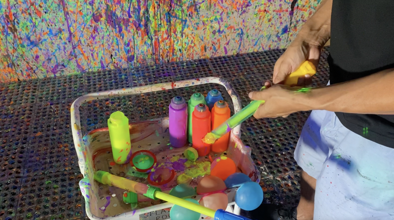 Splatter Studio: Guests can use squirt guns, use reusable water balloons that are filled with paint, brushes and other tools to put paint on your canvas. For this experience, a minimum of two people is required.