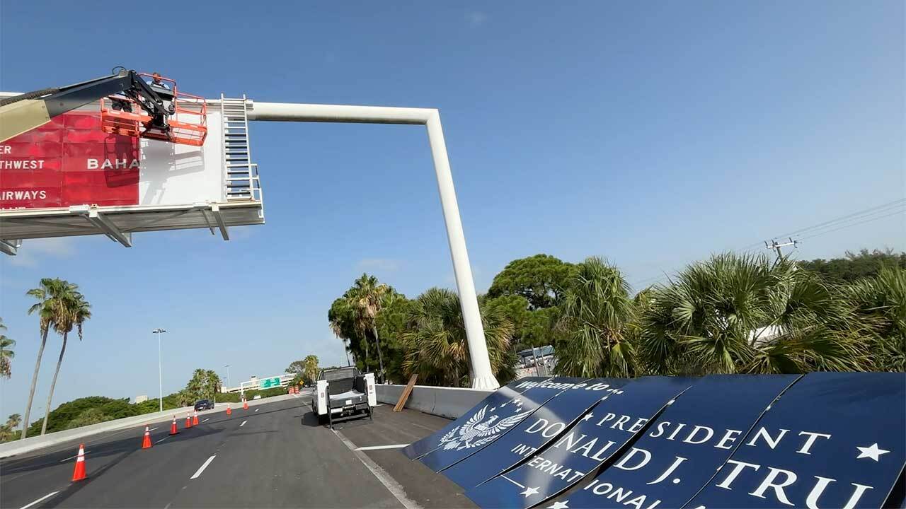 Workers were spotted at the airport entrance on July 8, 2026, adding a new sign that says "Welcome to President Donald J. Trump International Airport."