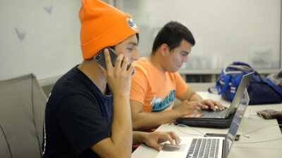 Gerson Quintersos and Christian Aovarezsilva participate in a phone back with United We Dream