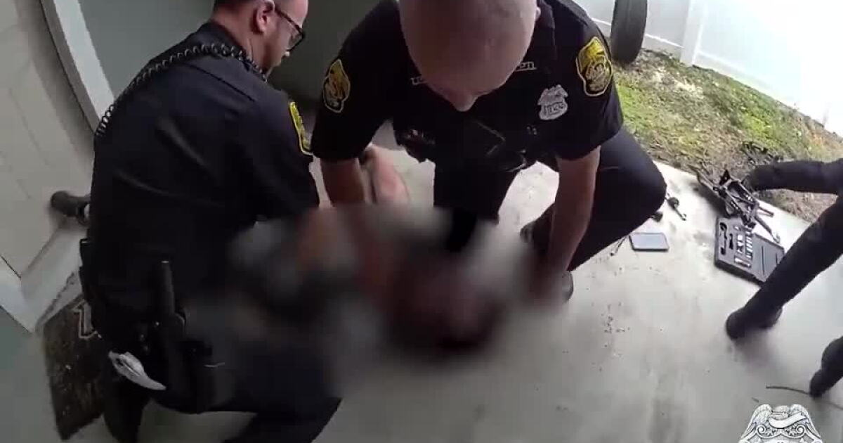 Watch Tampa Police officers lift car off man pinned under vehicle