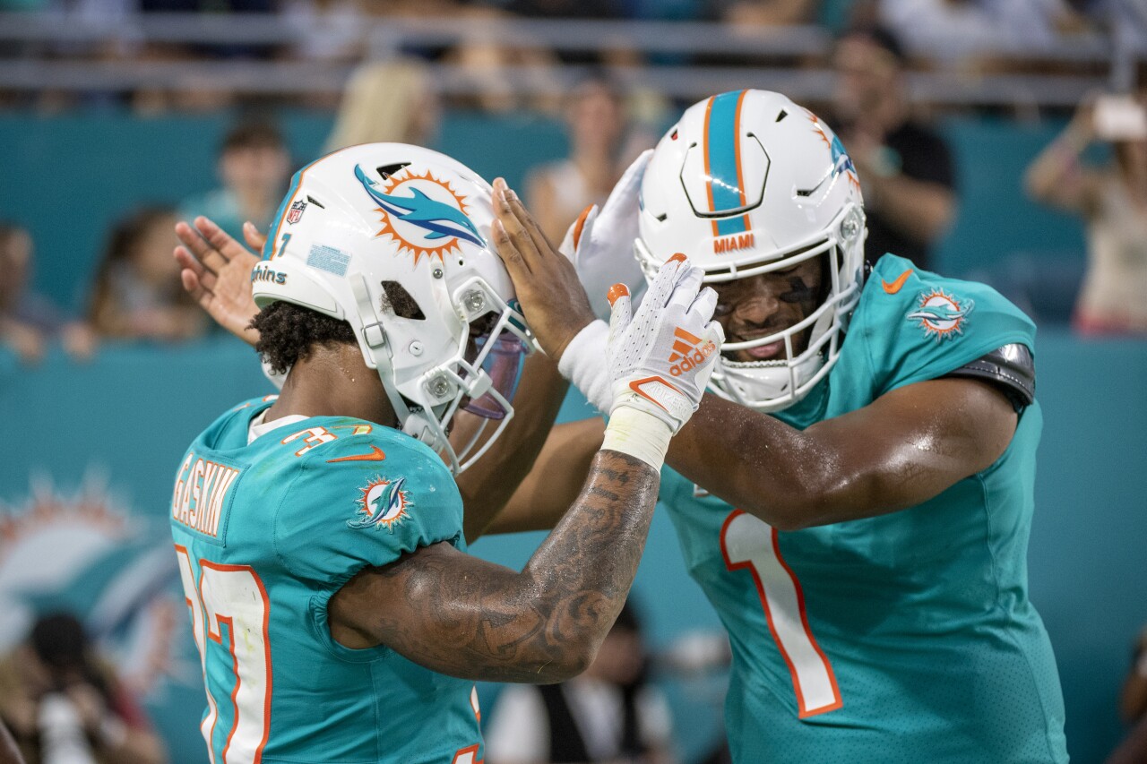 Miami Dolphins QB Tua Tagovailoa celebrates TD with running back Myles Gaskin in 2021 preseason game vs. Atlanta Falcons