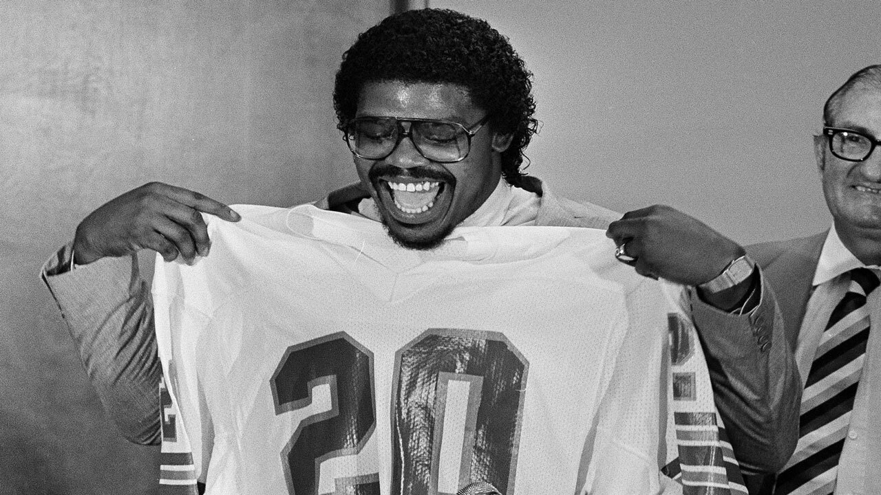 David Overstreet holds Miami Dolphins jersey in 1983